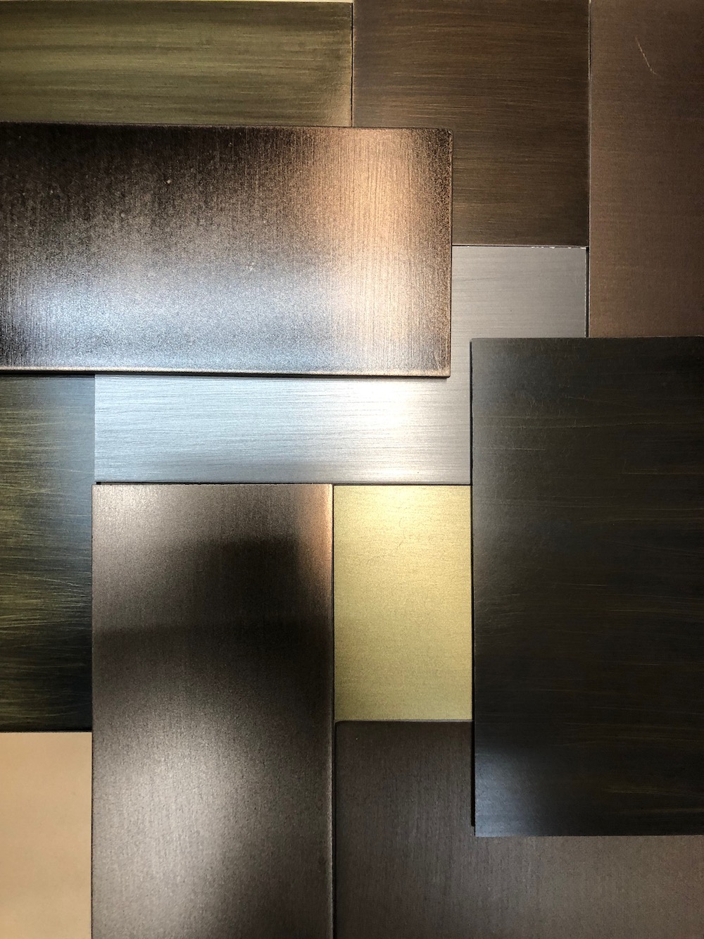 Various samples with brushed brass and bronze finishes